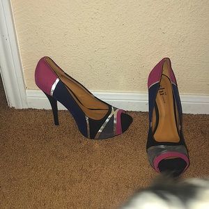 pair of beautiful color blocked peep toe heels